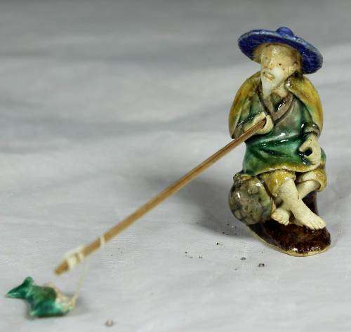 Mud Men - Seated man fishing