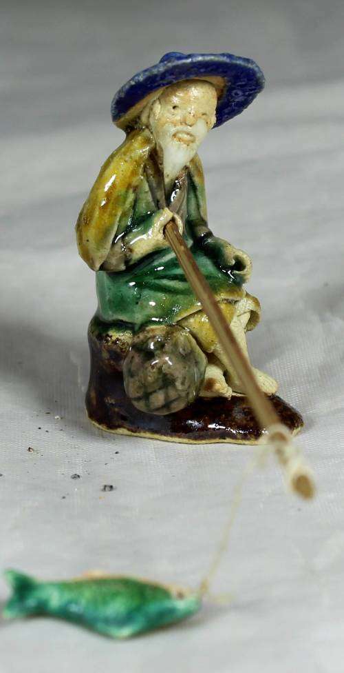 Mud Men - Seated man fishing