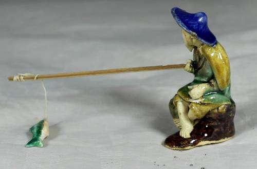 Mud Men - Seated man fishing