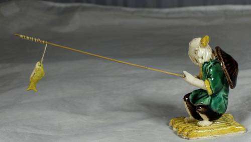 Mud Men - Old man fishing on a raft