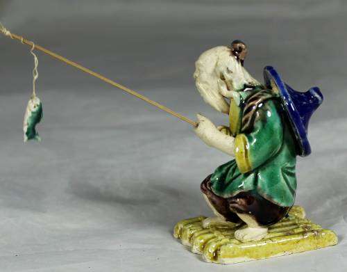 Mud Men - Old man fishing on a raft