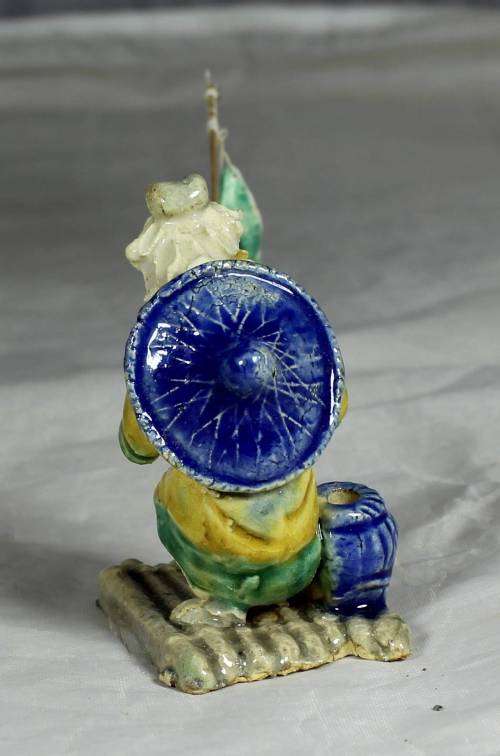 Mud Men - Old man fishing on a raft