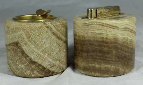 LOVELY LIGHTER AND ASHTRAY MOUNTED IN CARVED STONE BID NOW!