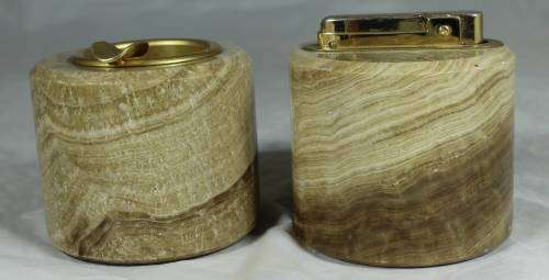 LOVELY LIGHTER AND ASHTRAY MOUNTED IN CARVED STONE BID NOW!