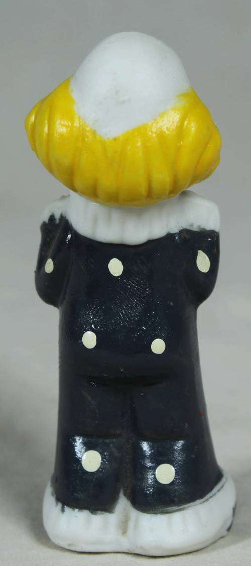 Miniature clown holding a red heart