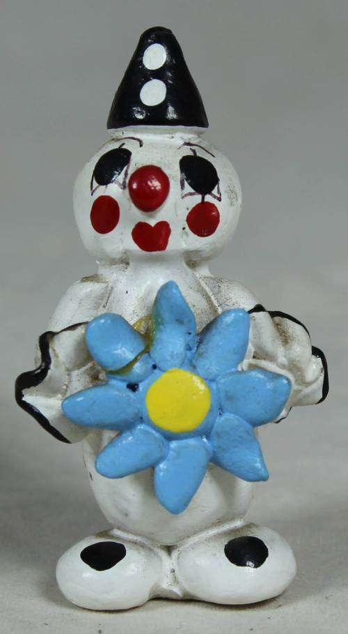 Miniature clown holding a large blue flower