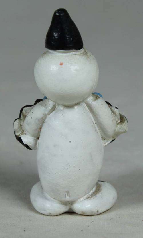 Miniature clown holding a large blue flower