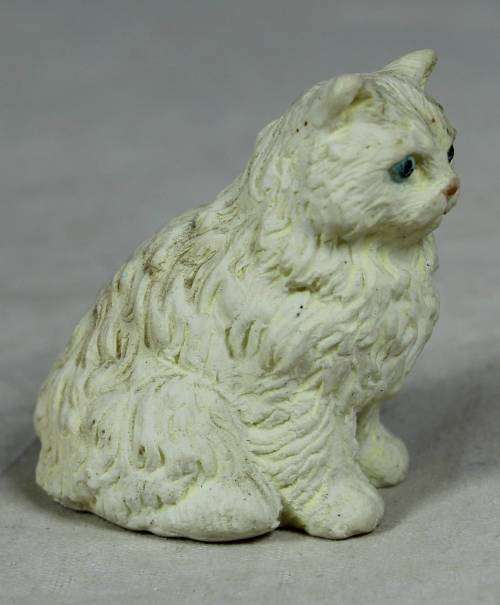 MINIATURE SERIOUS LOOKING WHITE CAT (AMUSING) BID NOW!!!