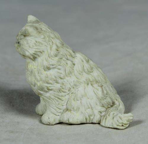 MINIATURE SERIOUS LOOKING WHITE CAT (AMUSING) BID NOW!!!