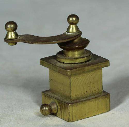 Miniature brass coffee grinder