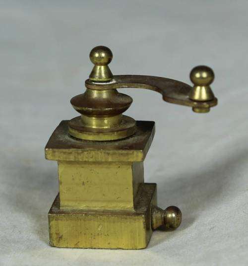 Miniature brass coffee grinder