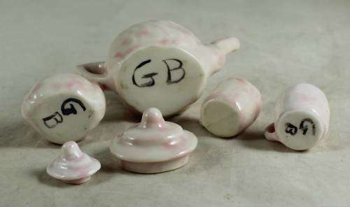 PINK KIDS TEA SET WITH A BABY FACE IMPRINT(LOVELY)BID NOW!!