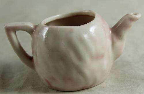 PINK KIDS TEA SET WITH A BABY FACE IMPRINT(LOVELY)BID NOW!!