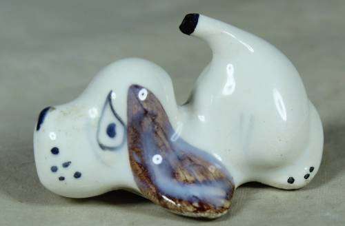 Playful porcelain doggy