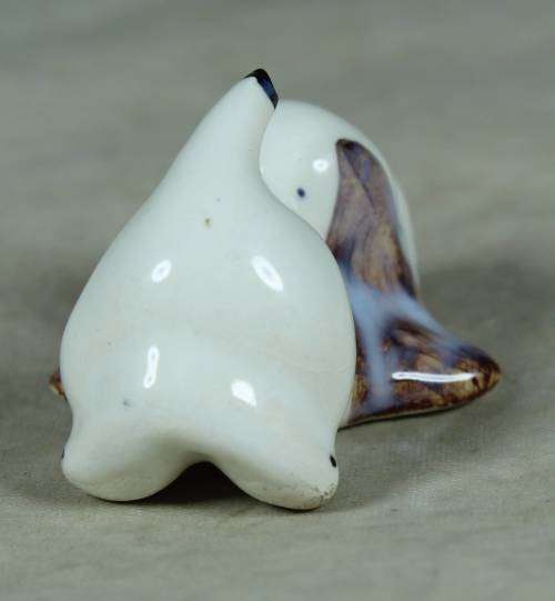Playful porcelain doggy