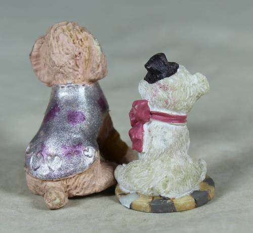 Miniature pair of hard plastic doggies
