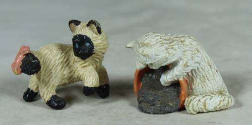 Pair of hard plastic playful cats