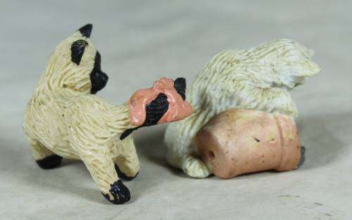 Pair of hard plastic playful cats