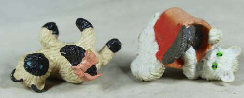 Pair of hard plastic playful cats