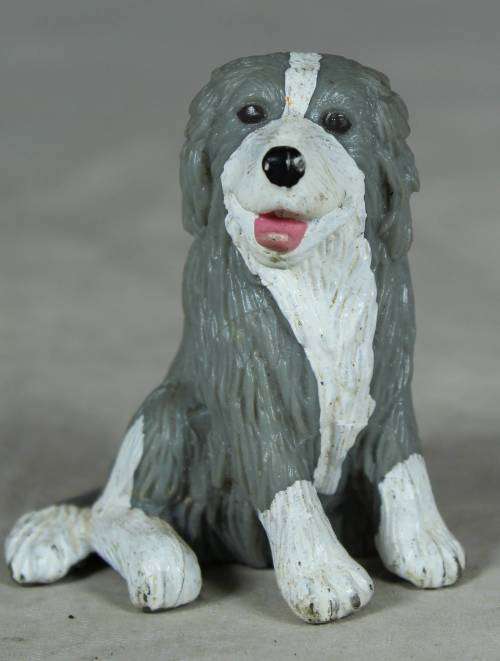 MEG plastic seated dog