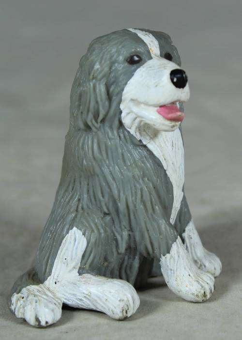 MEG plastic seated dog