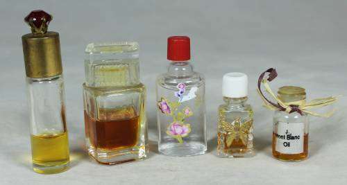 SET OF FIVE PERFUME BOTTLES WITH SOME LIQUID(BEAUTIFUL) BID NOW!!