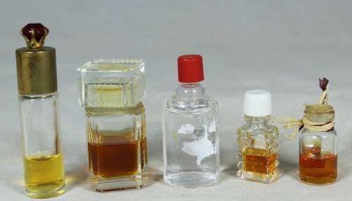 SET OF FIVE PERFUME BOTTLES WITH SOME LIQUID(BEAUTIFUL) BID NOW!!