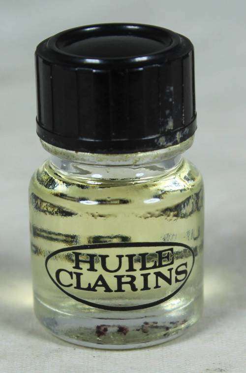 FULL MINIATURE BOTTLE OF HUILE CLARINS LOTUS PEAU GRASSE PERFUME (BEAUTIFUL) BID NOW!!