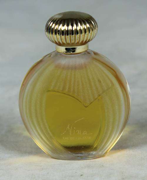 Full bottle of Nina Ricci perfume