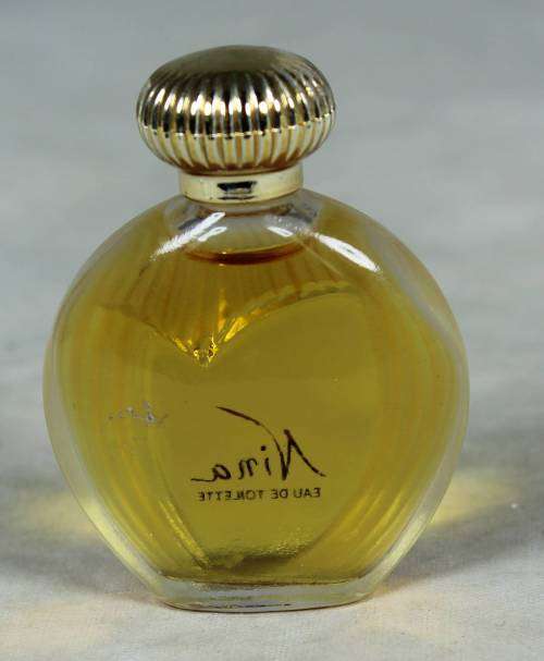 Full bottle of Nina Ricci perfume