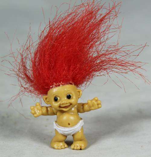 Miniature troll laughing baby