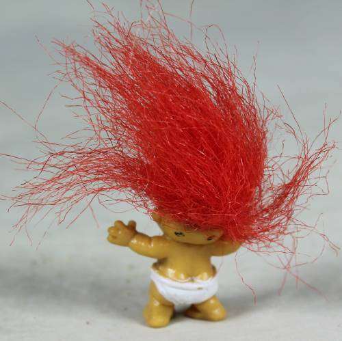 Miniature troll laughing baby