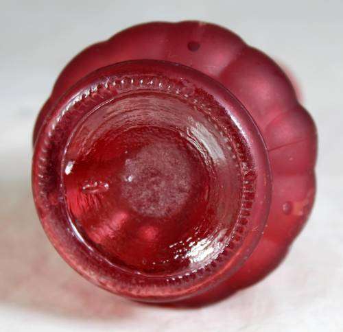 Small red ornate vase