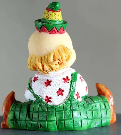 Small clown figurine baby with a ball