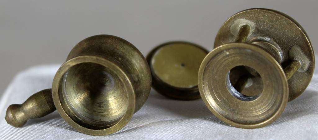 Miniature brass pot on gas burner