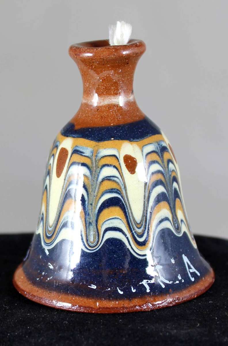 Small glazed pottery bell