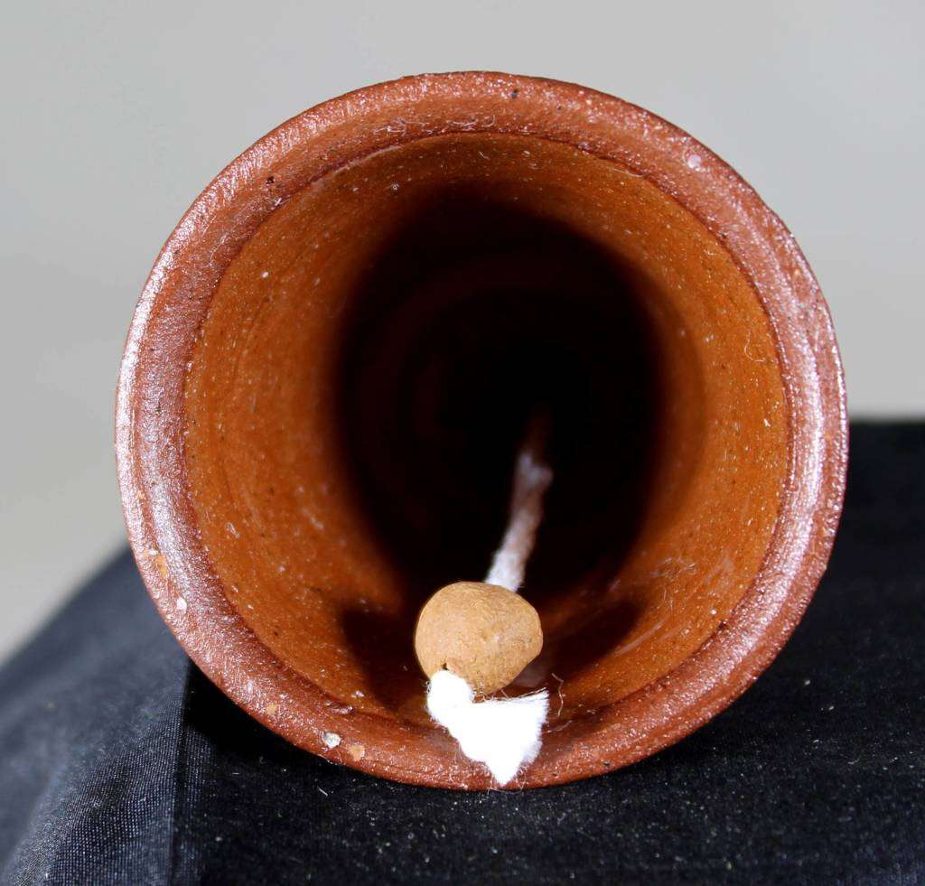 Small glazed pottery bell