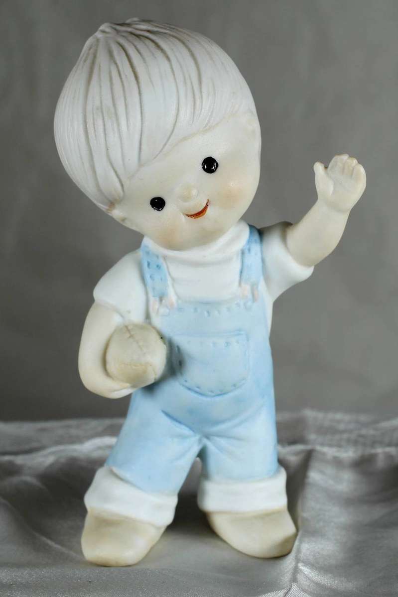 Vintage little boy with rugby ball