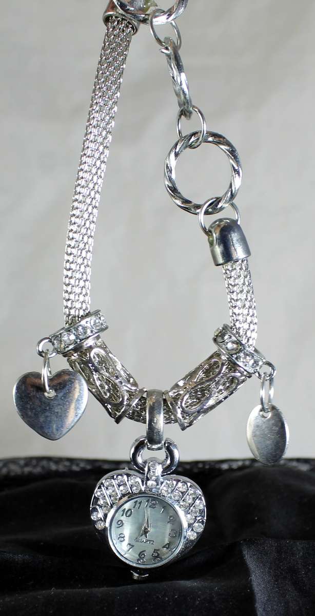 Quartz - silver bracelet watch with charms