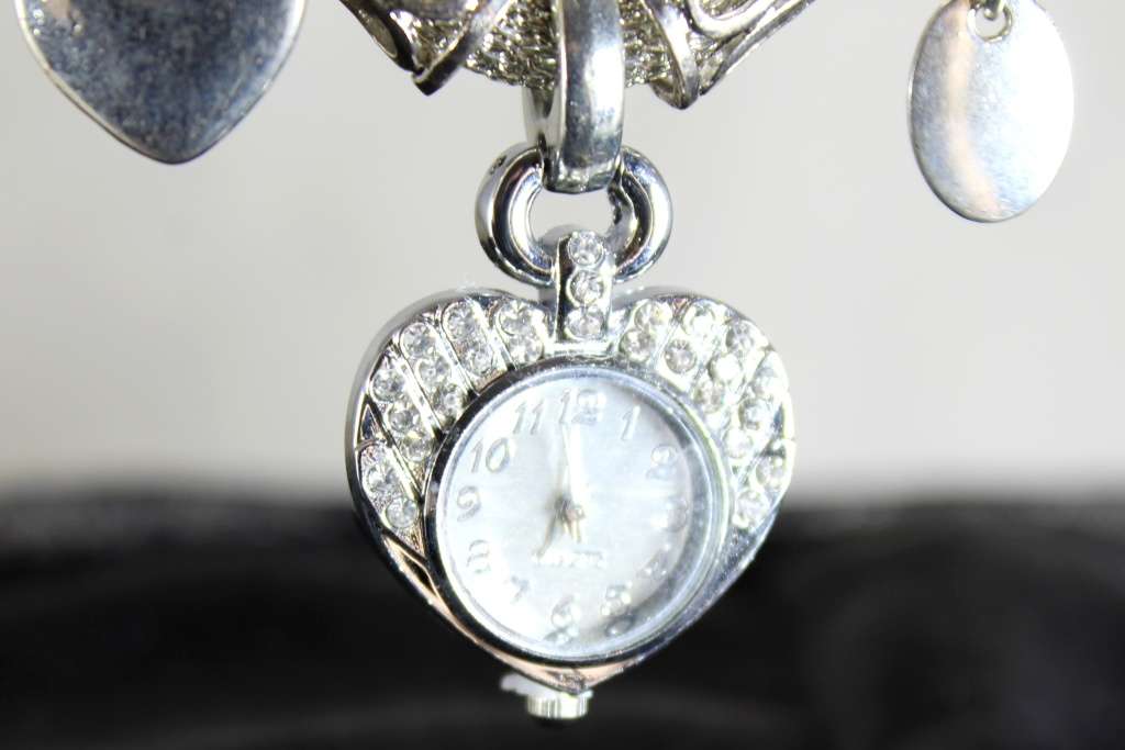 Quartz - silver bracelet watch with charms