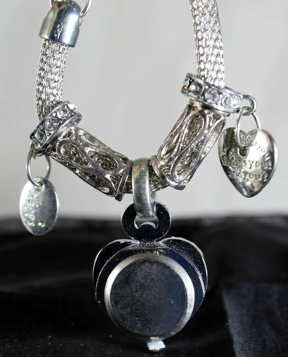 Quartz - silver bracelet watch with charms