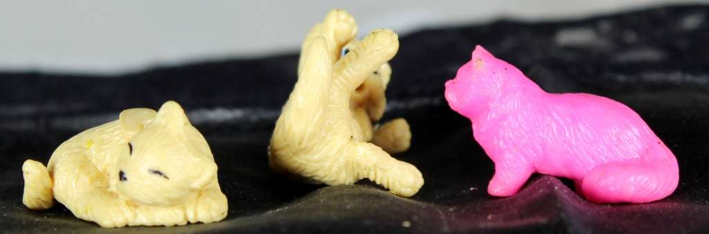 Miniature trio of cats