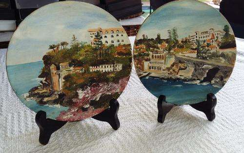 A set of two wooden painted plates signed by the artist - very attractive - see pics.