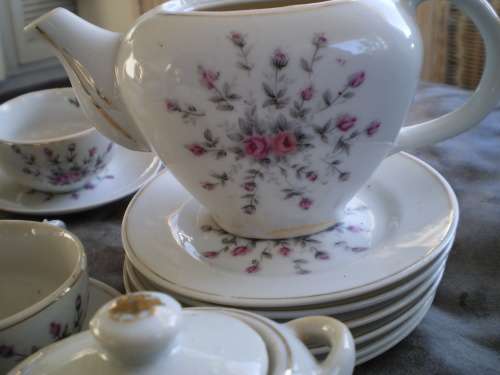 Vintage set of 5 floral miniature cups and saucers, plates one teapot and sugar pot