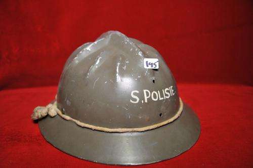 curious old metal helmet in original paint