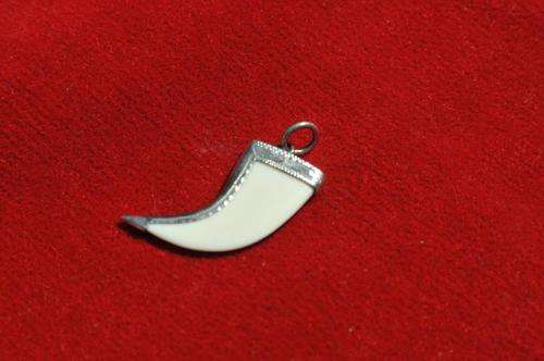 STERLING SILVER MOUNTED BONE PENDANT
