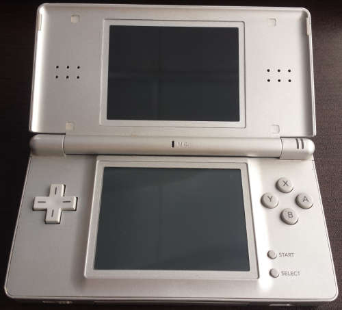 Silver DS Lite Console, Charger + Free game (Incl Warranty)