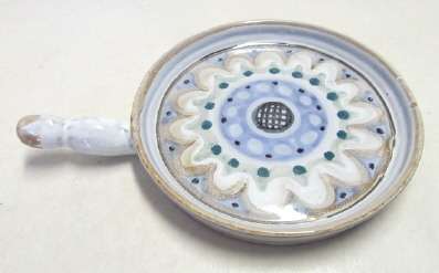 Snack dish with a handle, made by T.O.J. (The Old Jar pottery)