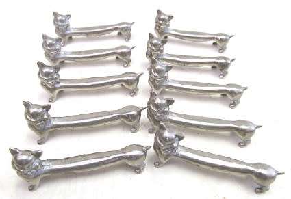 Set of 10 silver-plated cat knife rests
