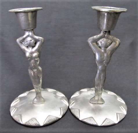 A pair of candlesticks by Carrol Boyes